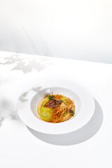 Roasted fish with crispy skin, celery cream and fresh herbs espuma. Fried halibut fillet on mashed celery and crunchy potatoes. Roasted fish fillet in elegant restaurant menu