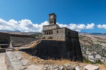 Clock tower and fortress at Gjirokaster, a beautiful town in Albania where the Ottoman legacy is clearly visible - 530515217