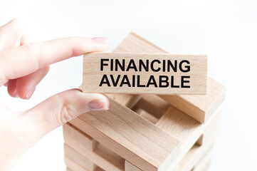 Business concept on wooden cubes. Text Financing is available.