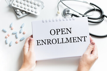 Open enrollment text on notepad, concept background