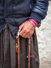 close up of a person holding rosary