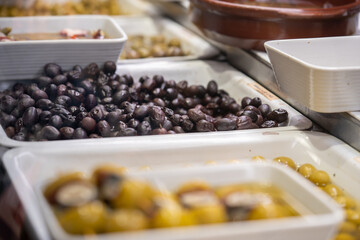 Variety of pickled olives on the market in Barcelona, Spain