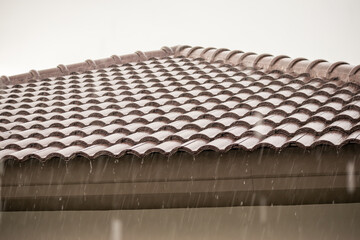 Fototapeta premium rain falling down from the house roof