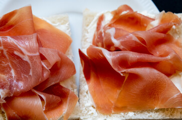 Sandwiches with sliced cured ham, close up
