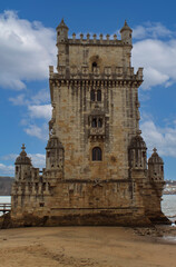 Obraz premium Exterior view of the historical Belem tower (Torre de Belém) on Tagus River in Lisbon, Portugal, Europe. 16th-century limestone fortification, an example of the Portuguese Manueline architecture style