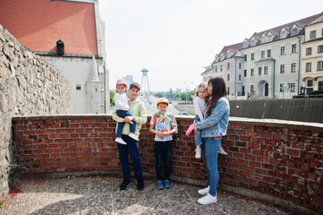 Obraz na płótnie Canvas Mother with kids on view of street Bratislava, Slovakia.