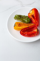 Close up of roasted bell pepper food healthy on white plate