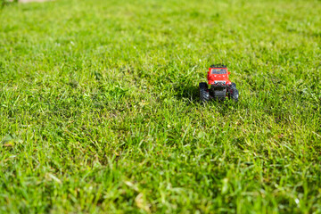 Children's toy off road car on the grass