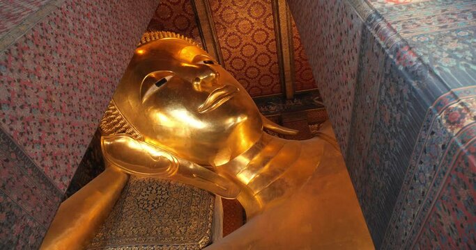 Reclining Buddha gold statue face. Wat Pho, Bangkok, Thailand, Amazing Thailand travel concept.
