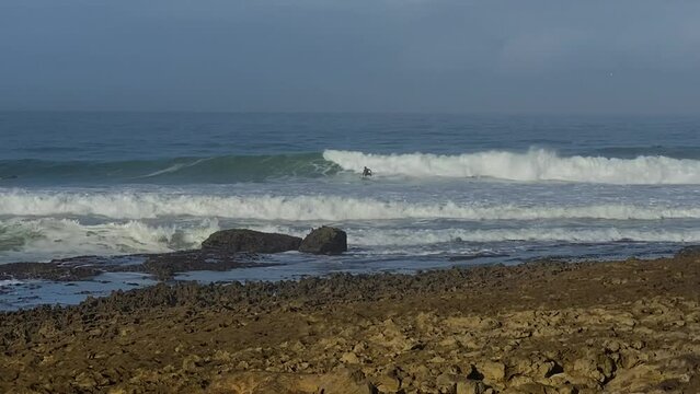 Professional Surfer on Coxos point break in Ericeira, perfect barrel. big snaps with a lot of water on air. Coxos, Ericeira, Portugal.