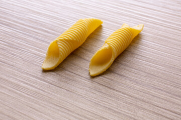 durum wheat pasta on a wooden base