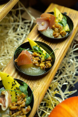 Canapes on a buffet on a wooden table