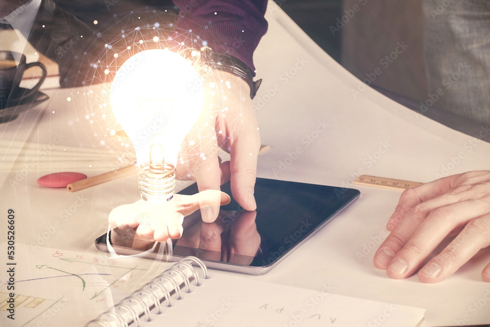 Poster Double exposure of man's hands holding and using a digital device and bulb hologram drawing. Idea concept.