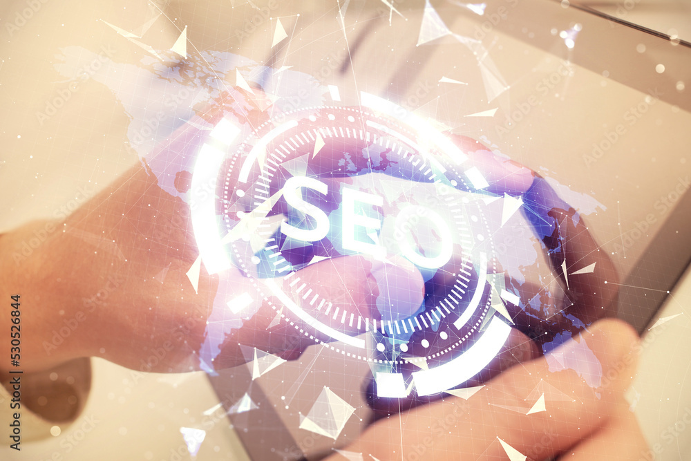 Aufkleber multi exposure of man's hands holding and using a digital device and seo drawing. search optimizatio