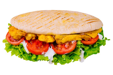 Doner kebab - fried chicken meat with vegetables in pita bread