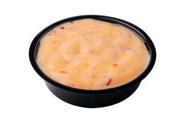 Creamy cheddar sauce isolated on white