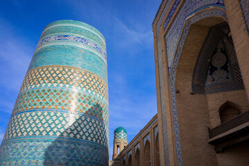 View to the unfinished Kalta Minor Minaret with Blue Mosaic Walls, which is built by Mohammed Amin Khan, in Khiva, Uzbekistan