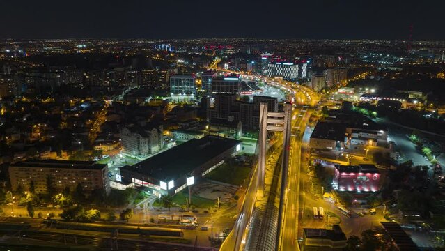 Bucharest City Traffic Driving In The Streets And Illuminated Basarab Overpass Bridge At Night In Romania. - aerial hyperlapse