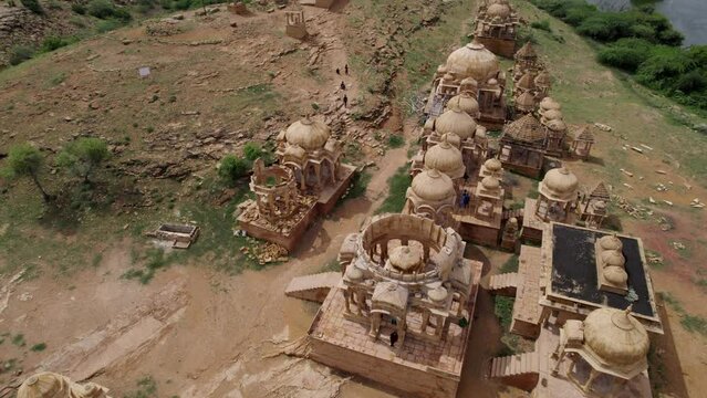 Bada Bagh temple in Jaisalmer. Lake in background. 4K aerial drone view