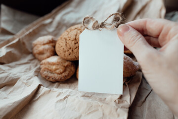 Bakery products with card for logo. Homemade cookies with sugar on a paper background. Background...