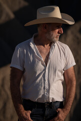 Adult man in cowboy hat in desert. Almeria, Spain