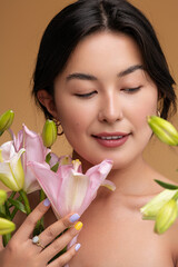 Happy young Asian woman with flowers
