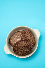 three fried ground meat in light brown bowl