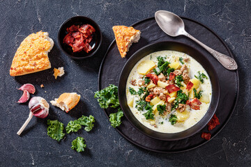 Zuppa Toscana,Tuscan Soup in black bowl, top view