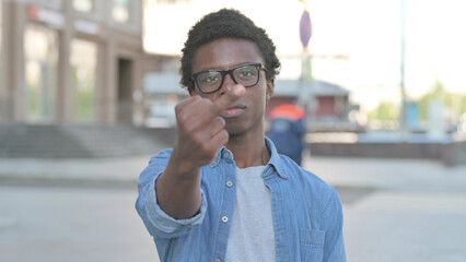 Angry Young African Man Showing Middle Finger Outdoor