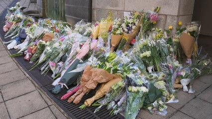 Flower bouquets are seen outside the British Consulate General as a tribute after the passing of the longest-serving monarch Queen Elizabeth II.