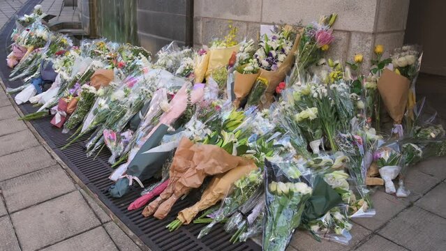 Flower bouquets are seen outside the British Consulate General as a tribute after the passing of the longest-serving monarch Queen Elizabeth II.