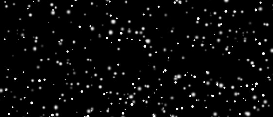 Snowfall bokeh on black background. Many snowflakes in flying in the air. Winte night snowfall and blizzard of snow at. Blur bokeh light effect creative background