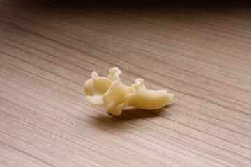 durum wheat pasta on a wooden base