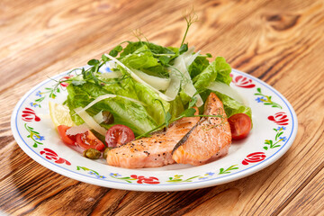 salmon steak with fresh salad