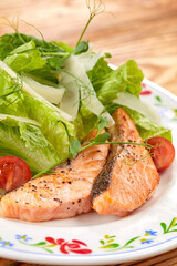 salmon steak with fresh salad