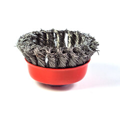 Metal cup brush on a white background. The brush is a cup made of twisted wire. metal brush for a...