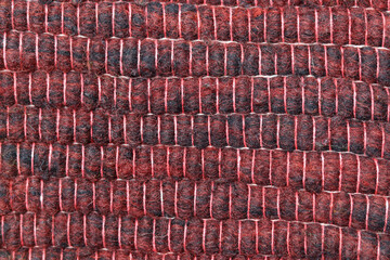 Red color wool yarn cloth background. Surface of fabric texture in valentine day. 