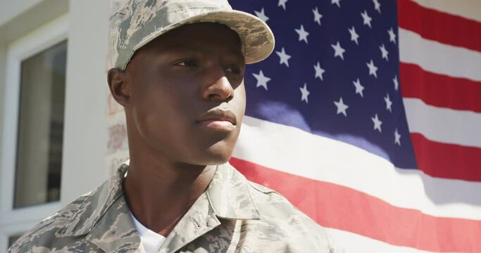Video of african american soldier standing outside house