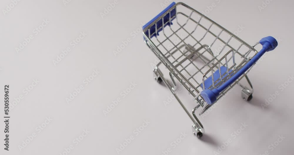 Poster high angle view of empty shopping trolley on white background with copy space