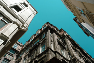 Beautiful view with old buildings and blue sky in Karakoy, historical aesthetic structures in Istanbul, landscape with buildings with clear sky, cityscape from Istanbul, travel and explore idea