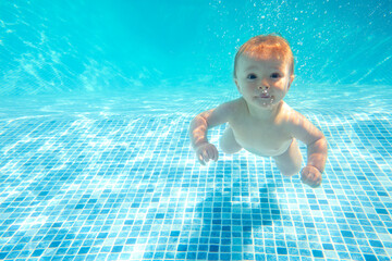 Baby Boy With Family On Summer Holiday Swimming Underwater In Pool
