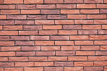 a new House is being built, the beginning of brickwork with red bricks, building