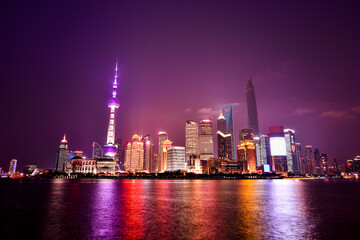 Fototapeta na wymiar The dazzling night view of Shanghai Bund - Oriental Pearl Tower. The view of the Bund at night is the most attractive view of Shanghai, China. 2014