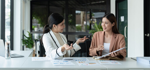 Business manager adviser consulting client discussing financial partnership contract sitting at table in office. - obrazy, fototapety, plakaty