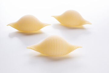 small composition of durum wheat pasta on a white background
