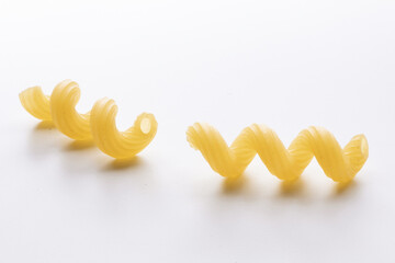 small composition of durum wheat pasta on a white background