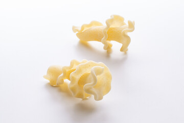 small composition of durum wheat pasta on a white background