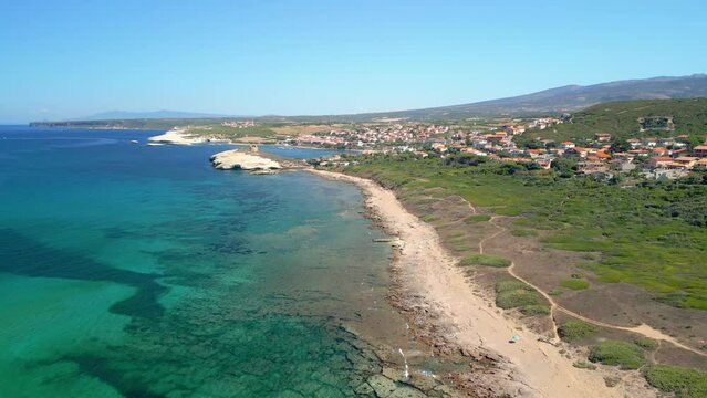 Aerial drone image of a beach in Sardinia Italy crystal clear turquoise blue green water