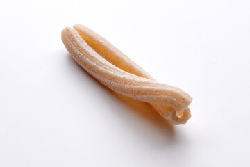 small composition of whole durum wheat pasta on a white background