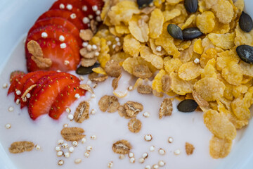 Ripe strawberries, yogurt and cornflakes. Healthy Breakfast Concept